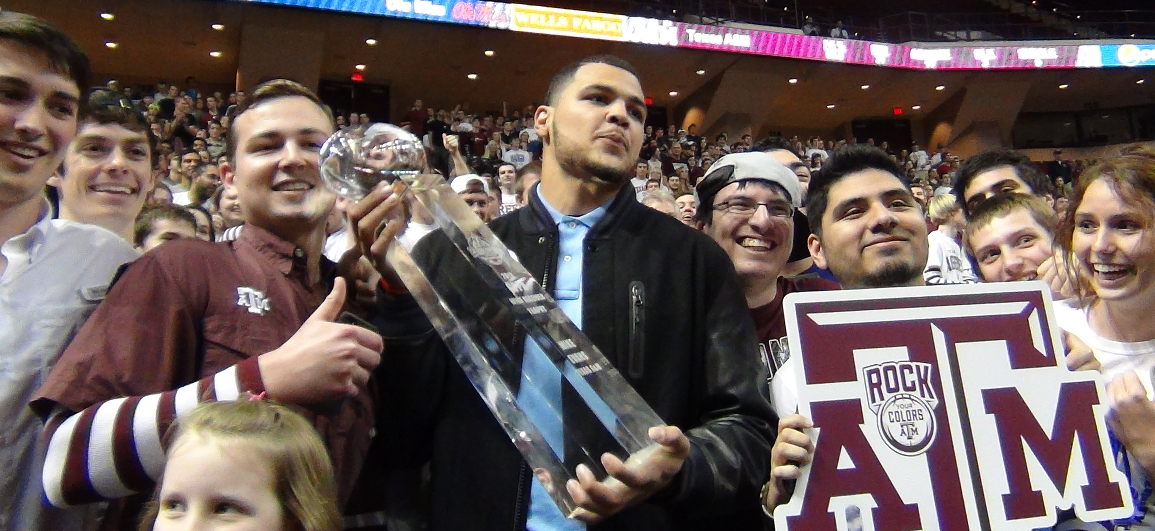 Mike Evans poses with the 12th Man student section