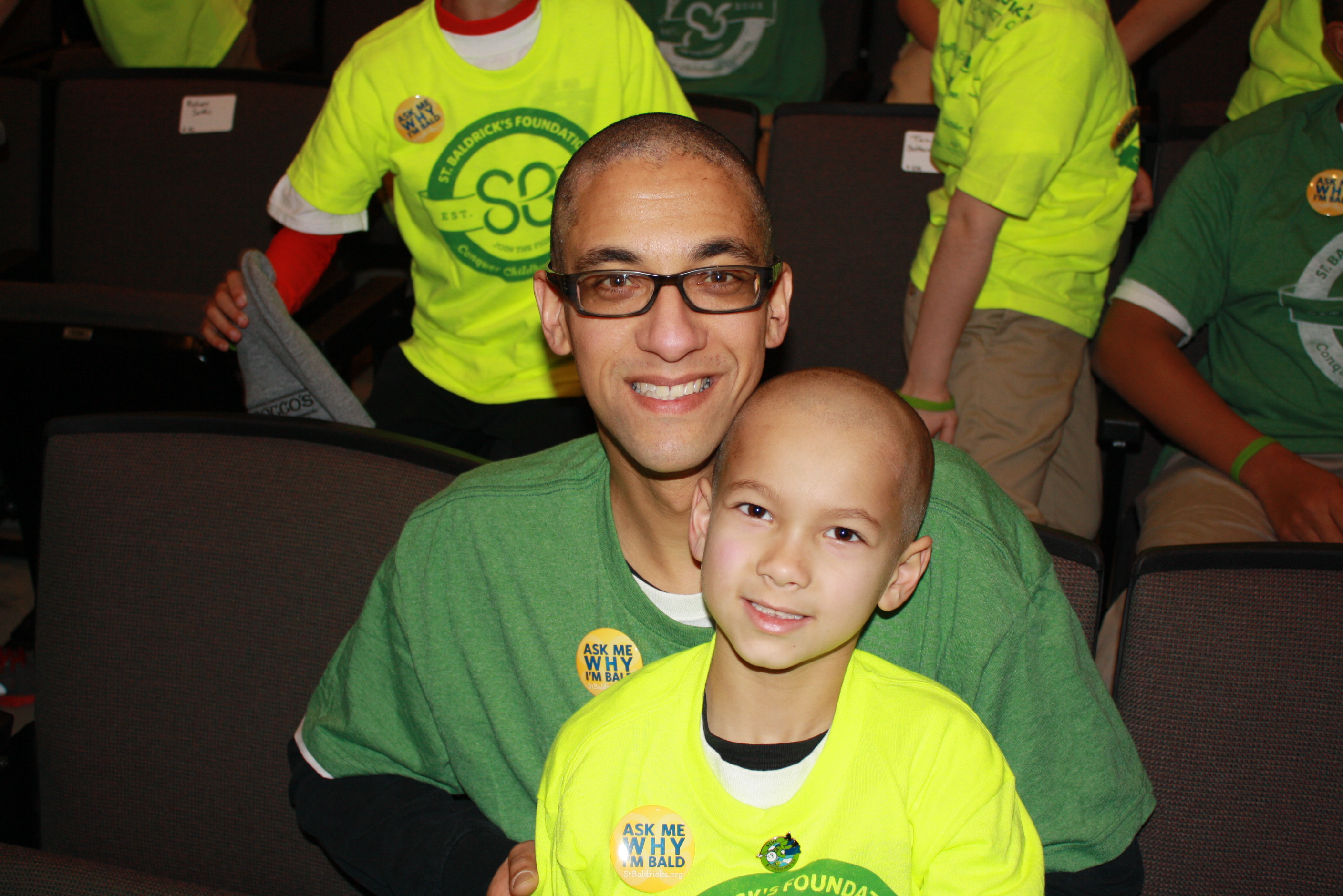 University School parent Christian Woolley and his 2nd grade son, Mason, are bald now!