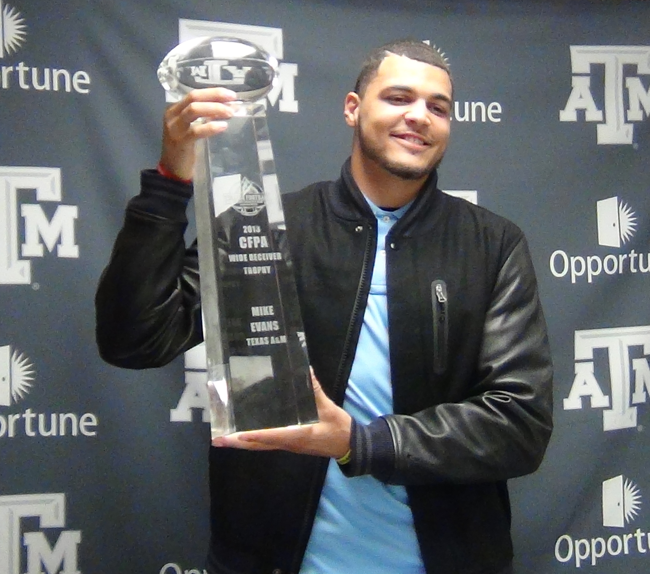 Mike Evans lifts the CFPA Trophy
