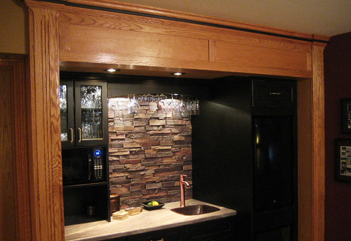 Elegant kitchen backsplash using faux stacked stone panels by FauxPanels.com