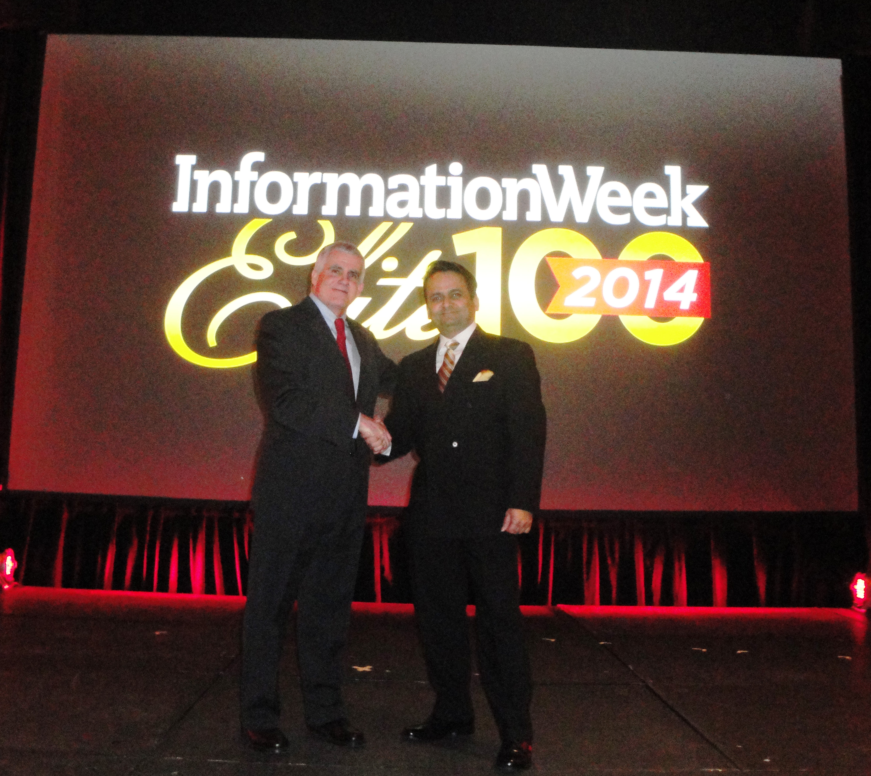 Niraj Jetly (r), NutriSavings SVP CIO/COO, receives award from Rob Preston, VP & Editor in Chief, Information Week