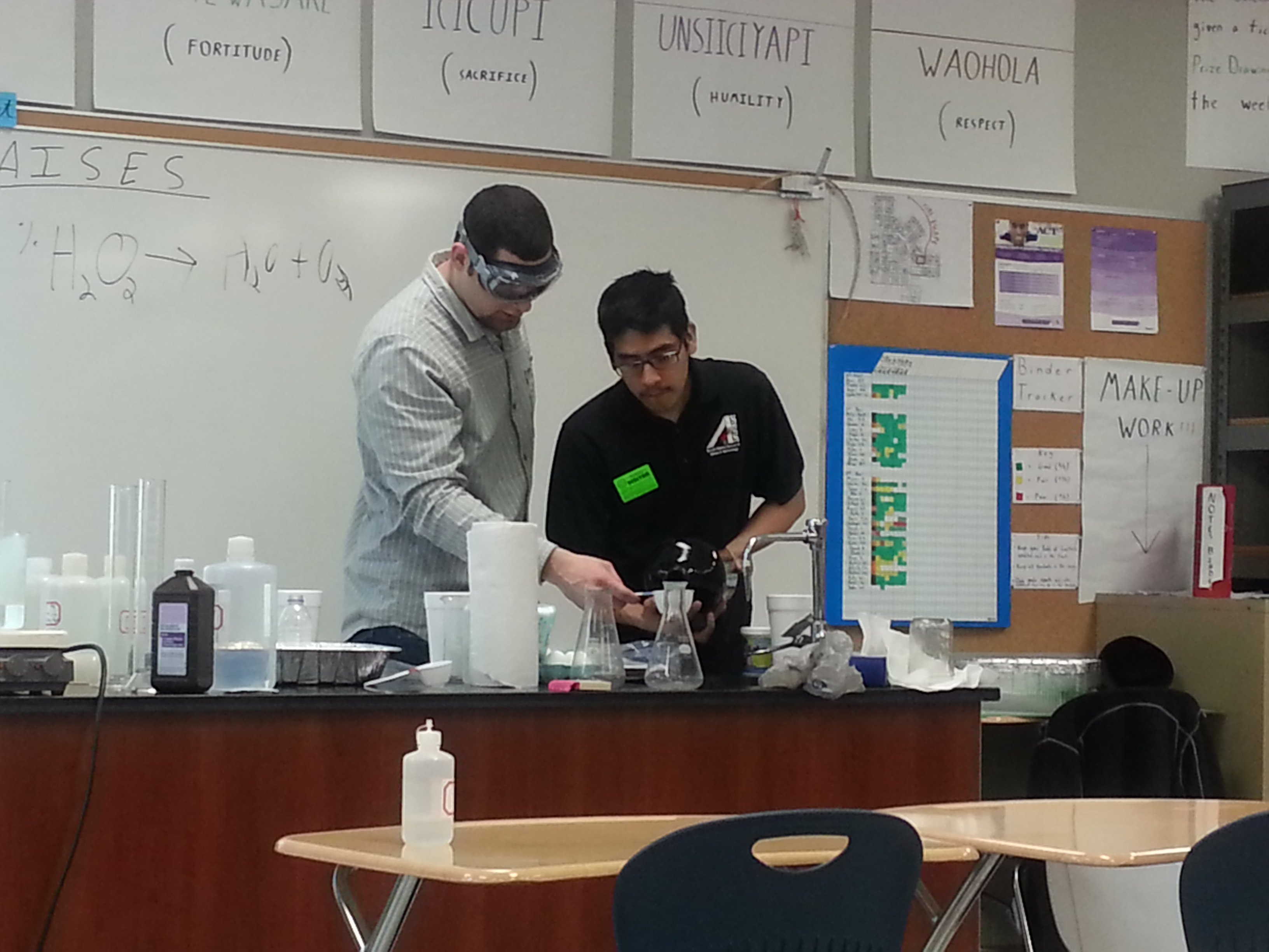 Students Jacob Phipps and Domingo Tamayo conduct chemistry experiments at schools on the Pine Ridge and Rosebud Indian reservations to empower Native American youth to pursue higher education.