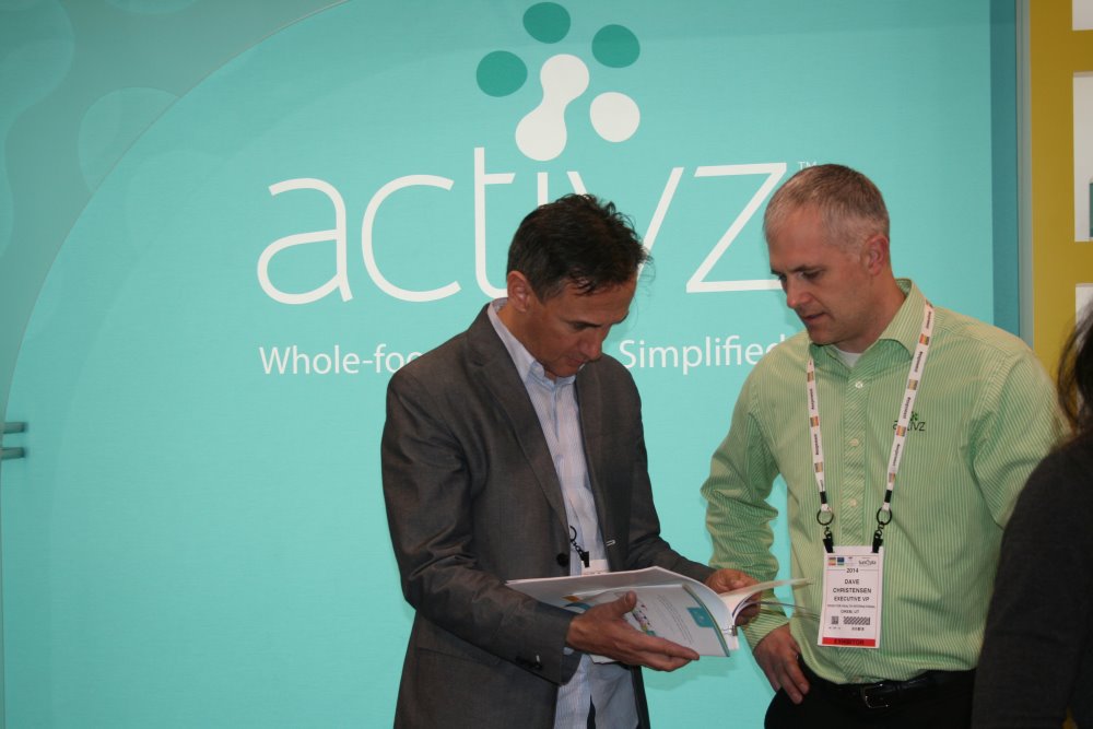Activz President Dave Christensen talks with visitors at Expo West.
