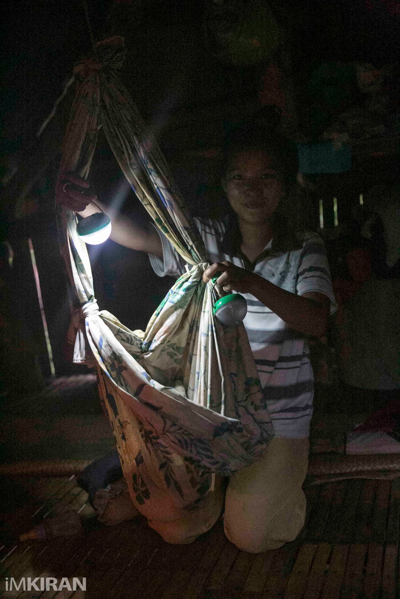 Nokero helps families worldwide. This young mother in the Philippines will never have to expose her newborn baby to kerosene thanks to Nokero solar lights. Photo Credit: iMKIRAN
