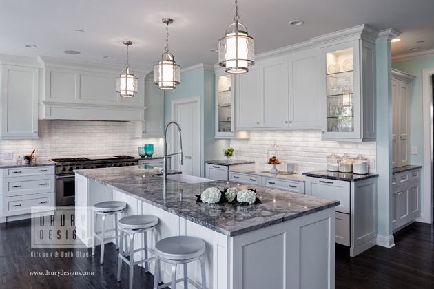 A single, wider island complete with a deep, single bowl apron front sink, offers more efficient work space. The granite-topped island also serves as a large gathering area.