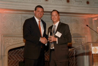 Rep. David Valadao (left) receives the 2014 Visionary Award from CHI President and CEO Todd Gillenwater (right).