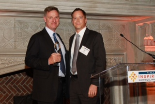Rep. Scott Peters (left) receives the 2014 Visionary Award from CHI President and CEO Todd Gillenwater (right).