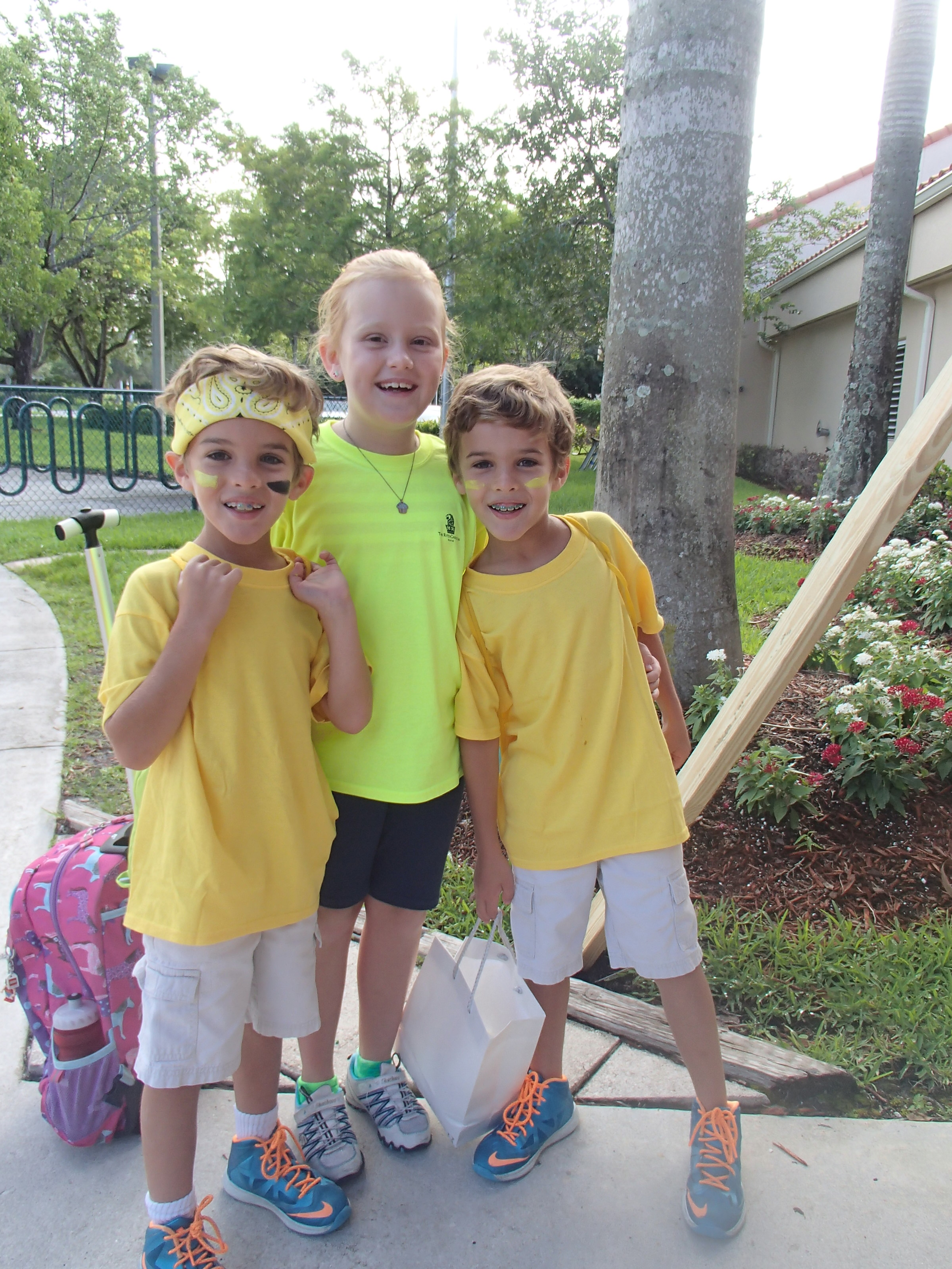 The yellow team arrives prepared to take on the red team during the Amazing Race Color War.
