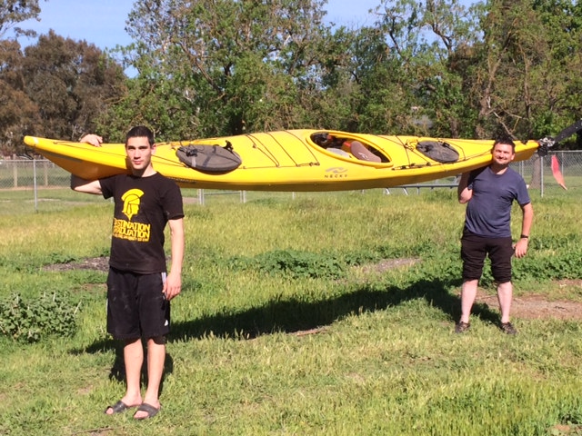 Father and Son Showing One of their Kayaks For Yukon River Adventure To Promote Blind Judo Foundation