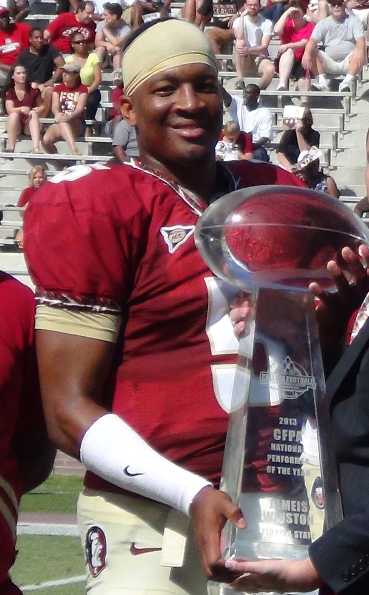 Jameis Winston with the CFPA National Performer of the Year Trophy