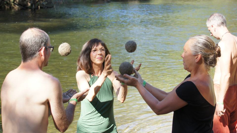 Tossing sand balls in an art in nature workshop