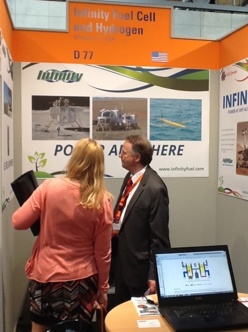 William Smith, Infinity Fuel Cell and Hydrogen, Inc. of South Windsor, Conn., talks with attendees at Hannover Messe 2014.