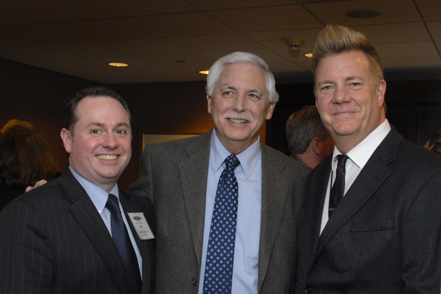 Welch Group President Richard Welch (center) congratulates Allerton House at Central Park's leadership team; Paul Casale Jr. (left), executive director and Al Ewing (right), marketing director.