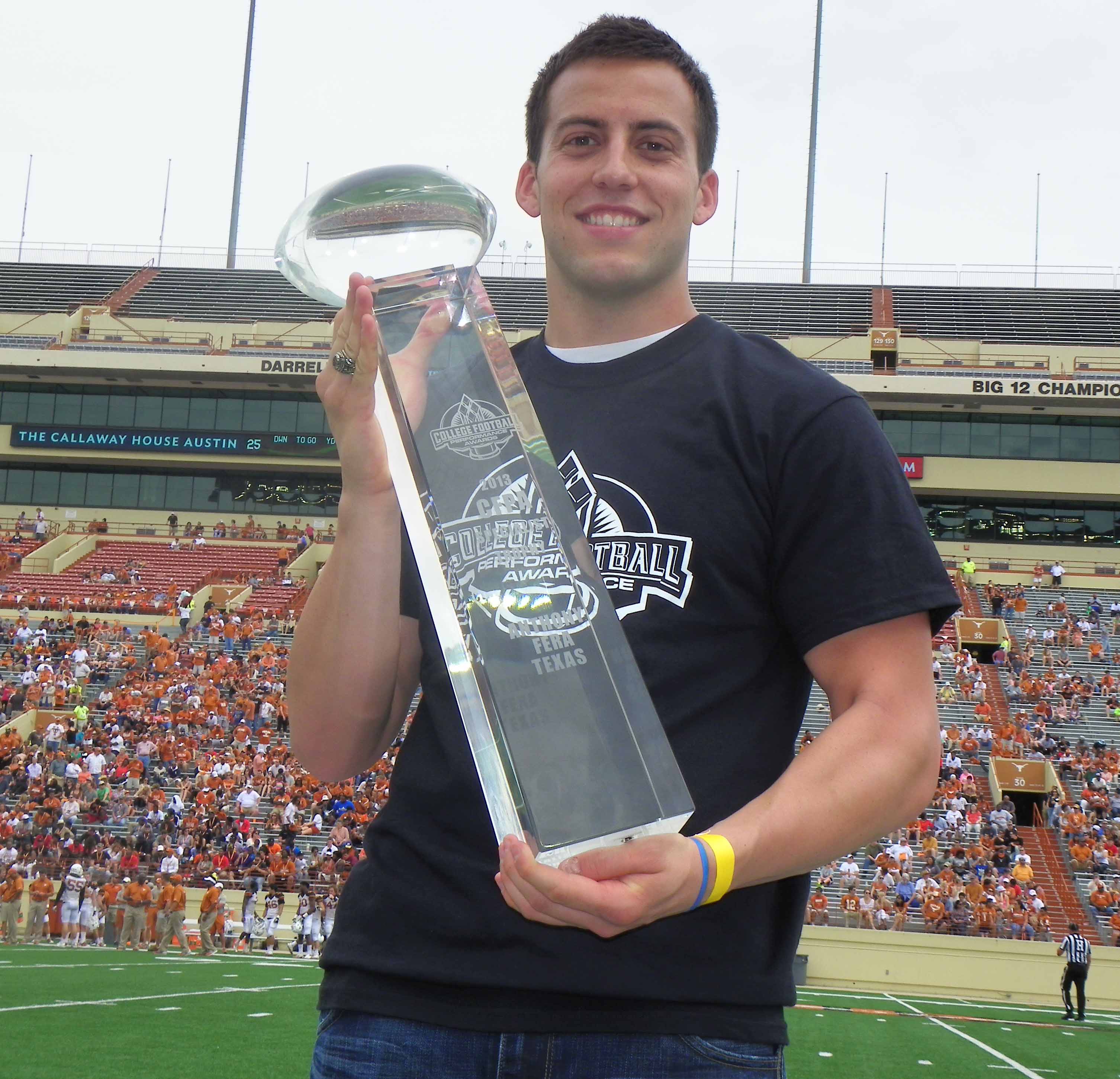 Anthony Fera lifts the CFPA Trophy