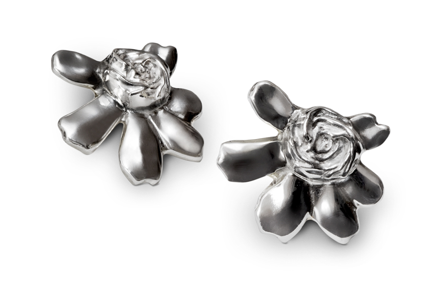 Repousse' Jewelry's founder Carolyn O'Keefe loves the look of Simply Gardenia earrings.