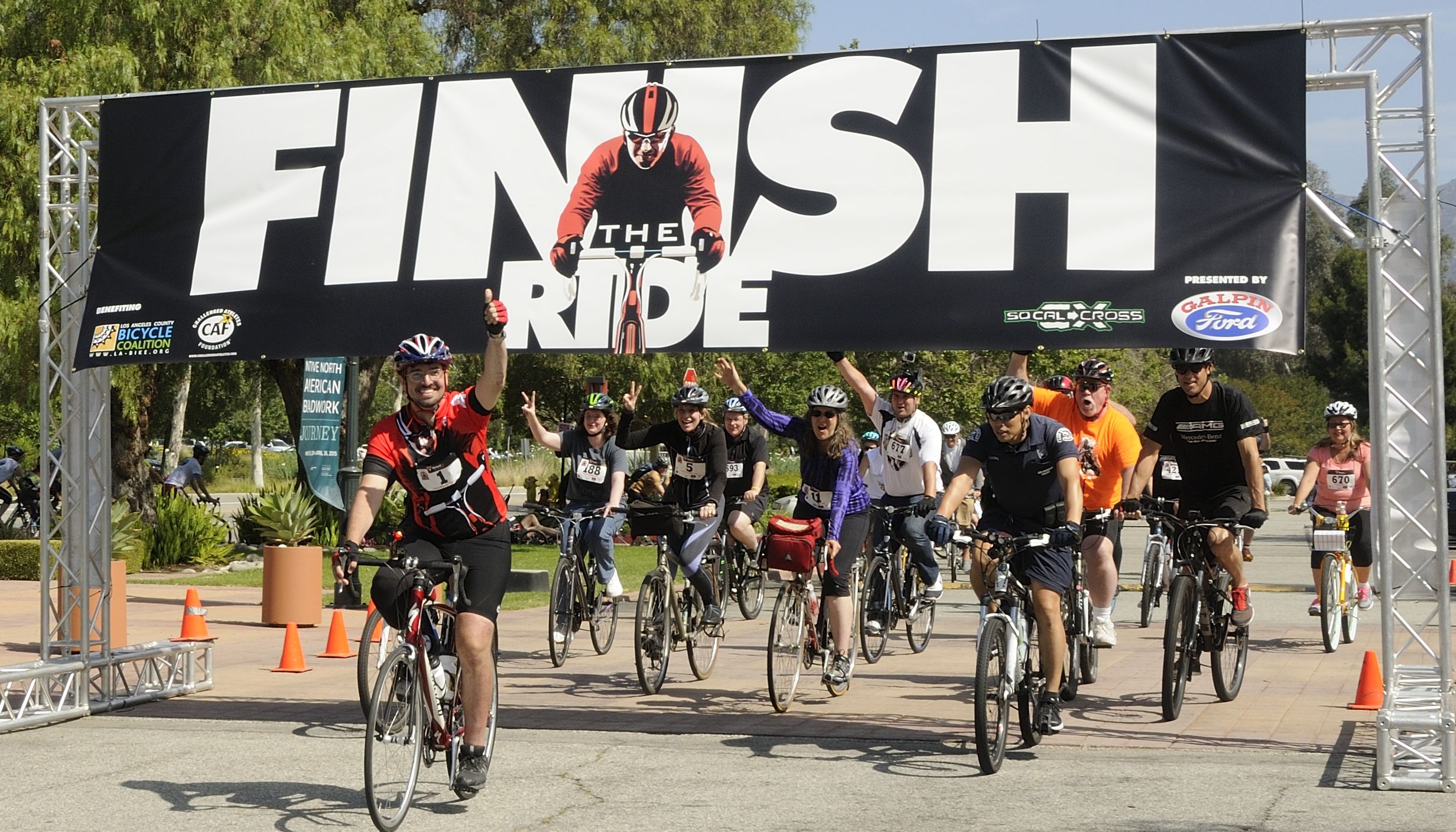 Damian Kevitt crosses the finish line at the Autry Museum in Griffith Park Sunday April 27, 2014, completing the ride he began in February 2013—a ride that nearly took his life.