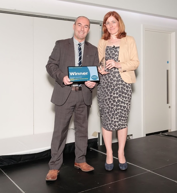 Tony Bracey, Multi Agency Information Transfer (MAIT) Project Manager, at the Joint Emergency Services Group, receiving his Award from Helen Platts, Head of Finance and Business Management at the Loca
