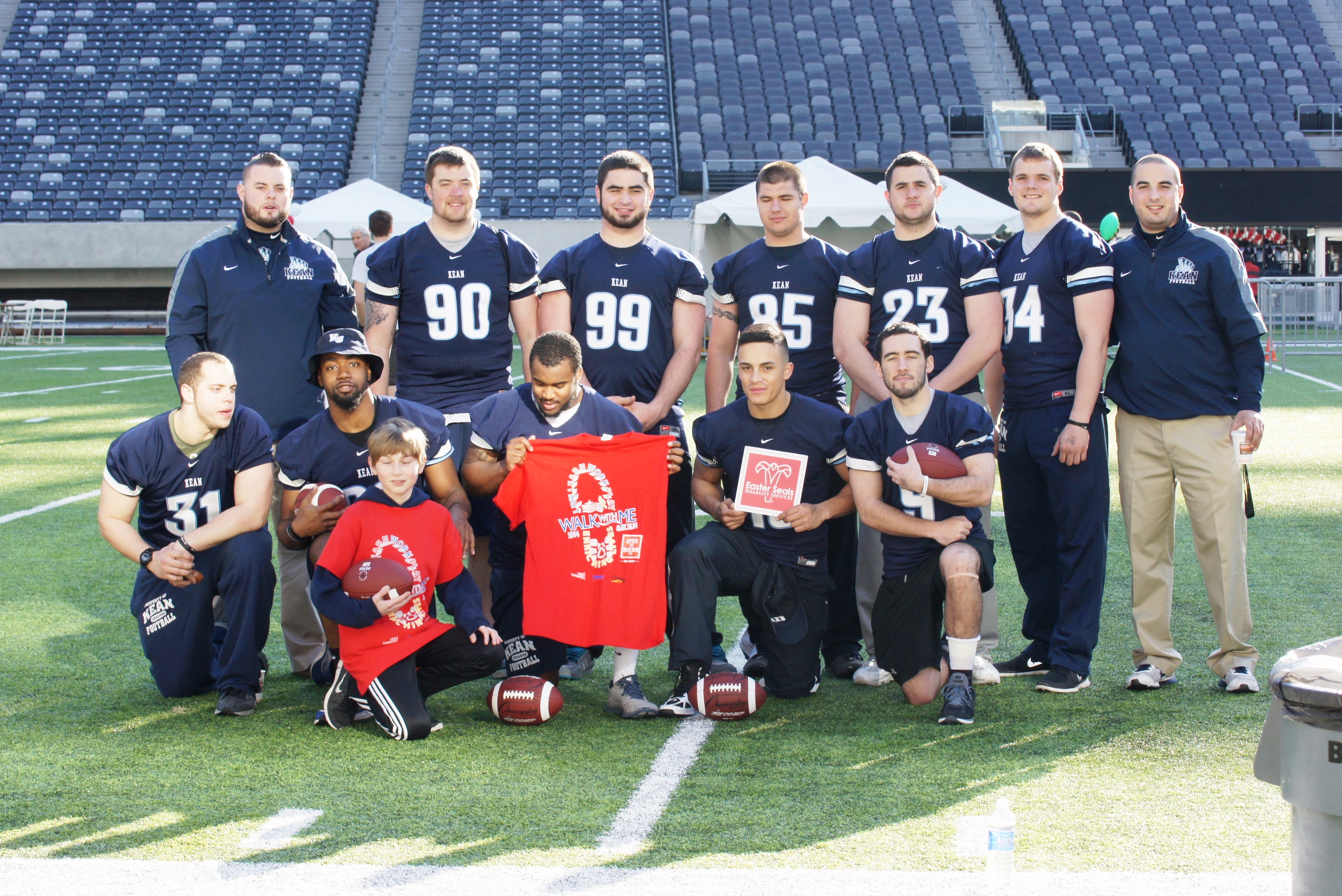 Football players from Kean University volunteered to man the on-field kids activities in the end zone