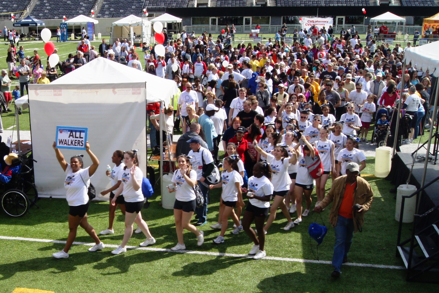 Cheerleaders from Mary Help of Christians Academy in North Haledon lead the walkers