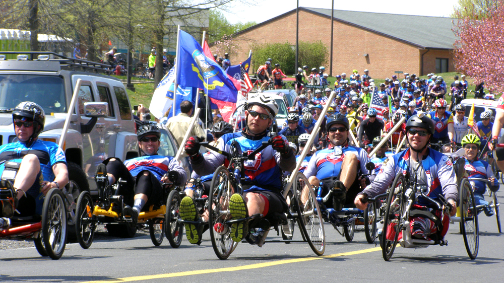 Injured veterans lead the way as the riders depart a Maryland rest stop on April 26. Richard Rhinehart photograph.