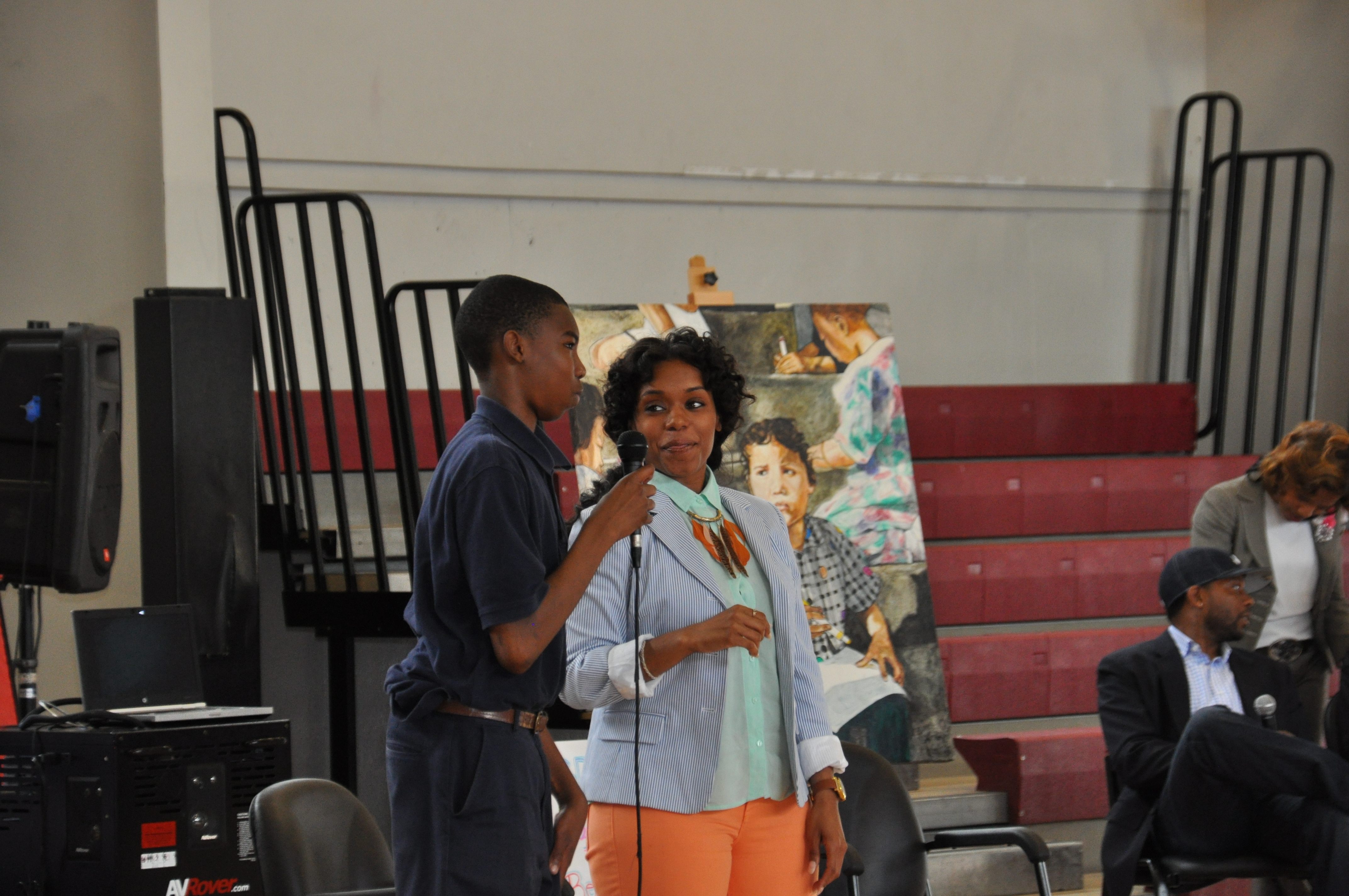 Chester Community Charter School (CCCS) eighth-grader Vatangoe Donzo (left) stands with Syreeta Martin, journalist and consultant (right), during a question-and-answer session at the school’s recent F