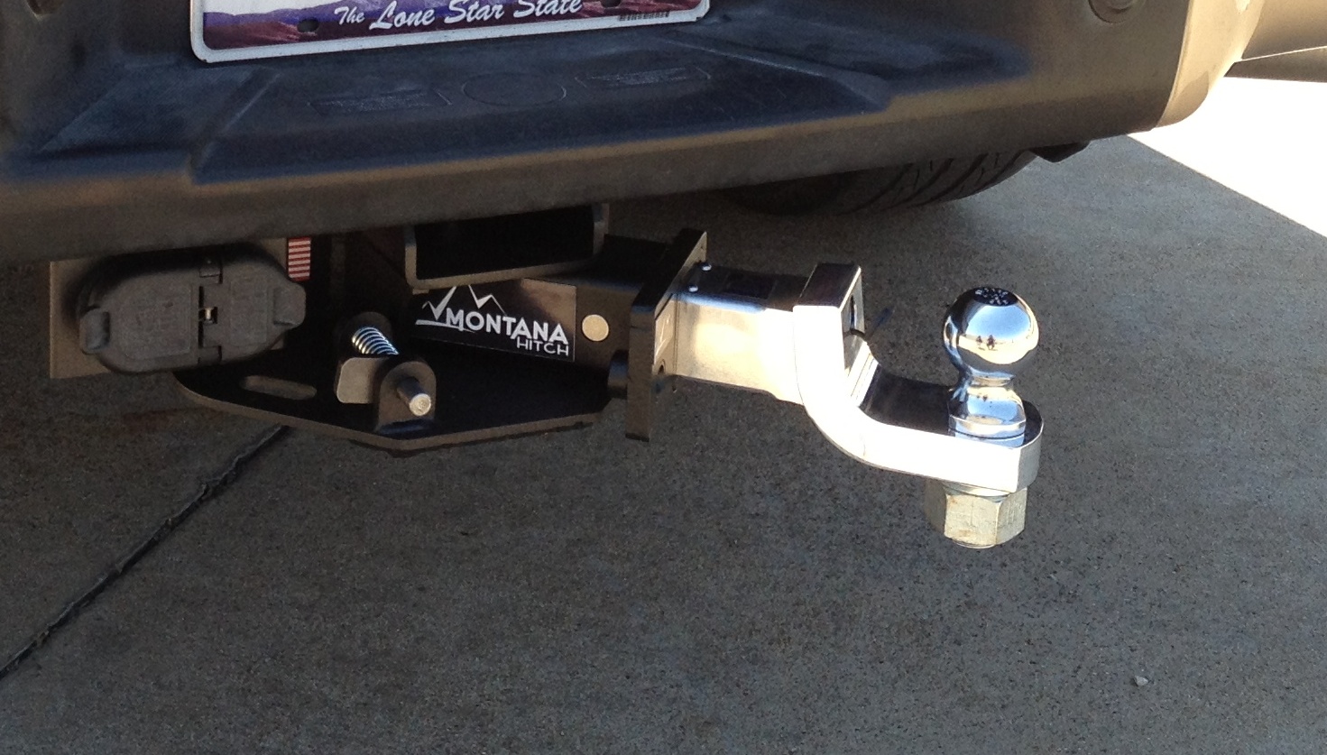 Unique Hitch Stows Under Truck with Push of Button.