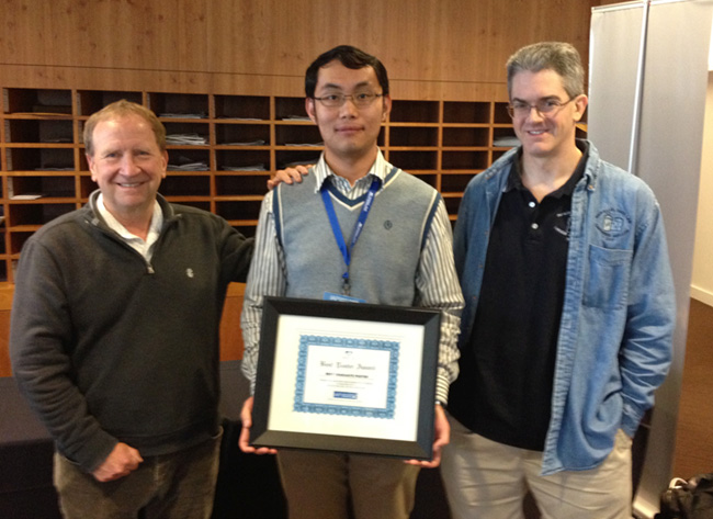 Professor Greg Ganger (right) and Dr. John Busch SanDisk Vice President and Fellow (left) congratulate Jinglei Ren, Winner of Best Graduate Student Poster.