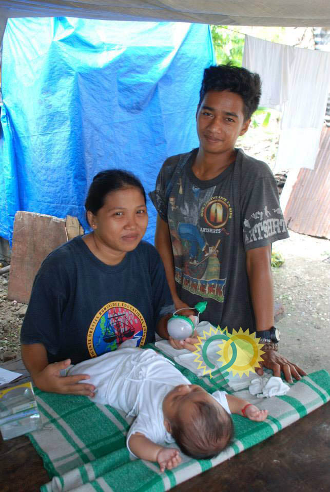 Nokero solar lights promote sustainable lifestyles around the world. In the Philippines, this couple will never have to expose their child to dangerous fuels because they have a Nokero light. Photo cr