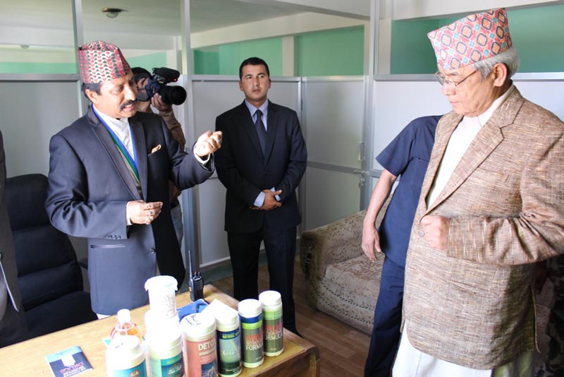 Kunwar demonstrates to Nepal Dep Prime Minister the Narconon use of vitamins and nutrients in its drug-free program.