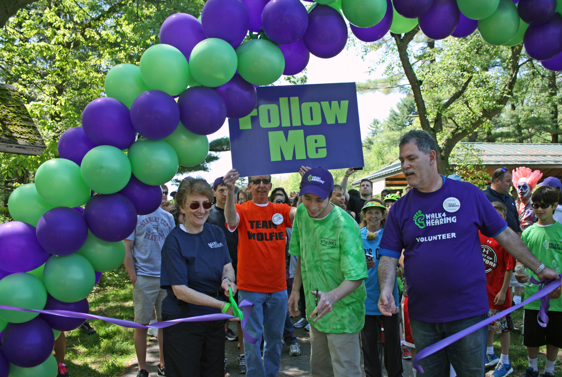 Dr. Gloria Schlisselberg, head of the Speech & Hearing program at Mercy College; Jacob Landis of Jacob’s Ride; David Goldwasser, Westchester/Rockland Walk4Hearing co-chair, cut the ceremonial ribbon.