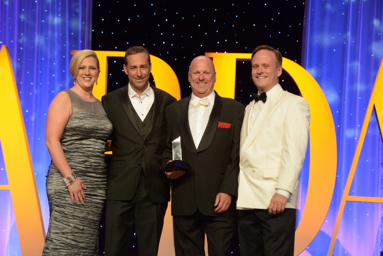 Vice President of Sales Dave Stroeve and Owner and Developer of Breckenridge Grand Vacations, Michael Millisor accept the Producer of the Year Award at the 2014 Awards Gala in Las Vegas.