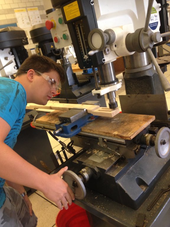 Sean Bowers builds the neck for a cigar box guitar in the Rocklin High School engineering technology lab.