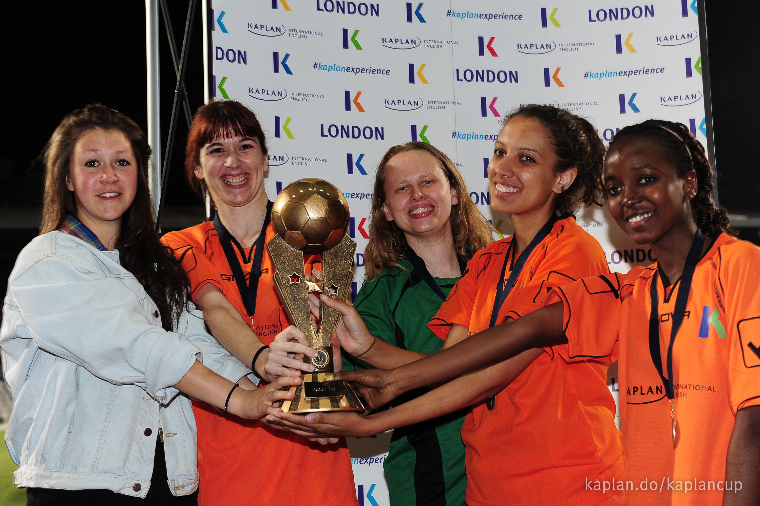 World Team celebrate with the women's trophy.
