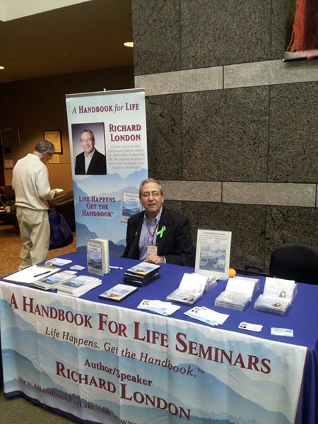 Richard London at a recent conference preparing to autograph his materials.