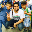 Omar Al-Chaar pictured with two 3rd grade Syrian Students, Amman, Jordan