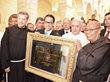 Fr. Peter Vasko, ofm, (left) presents Pope Francis with honorary plaque