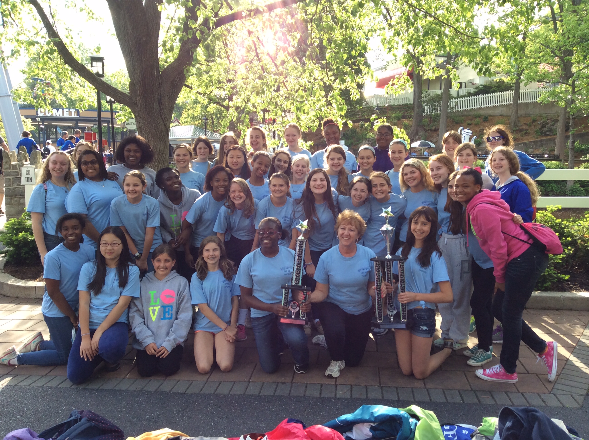 Music Director Ginny Flynn and the Garrison Forest Middle School Choir with their 1st places trophies at the 2014 Music in the Parks competition at Hershey Park.