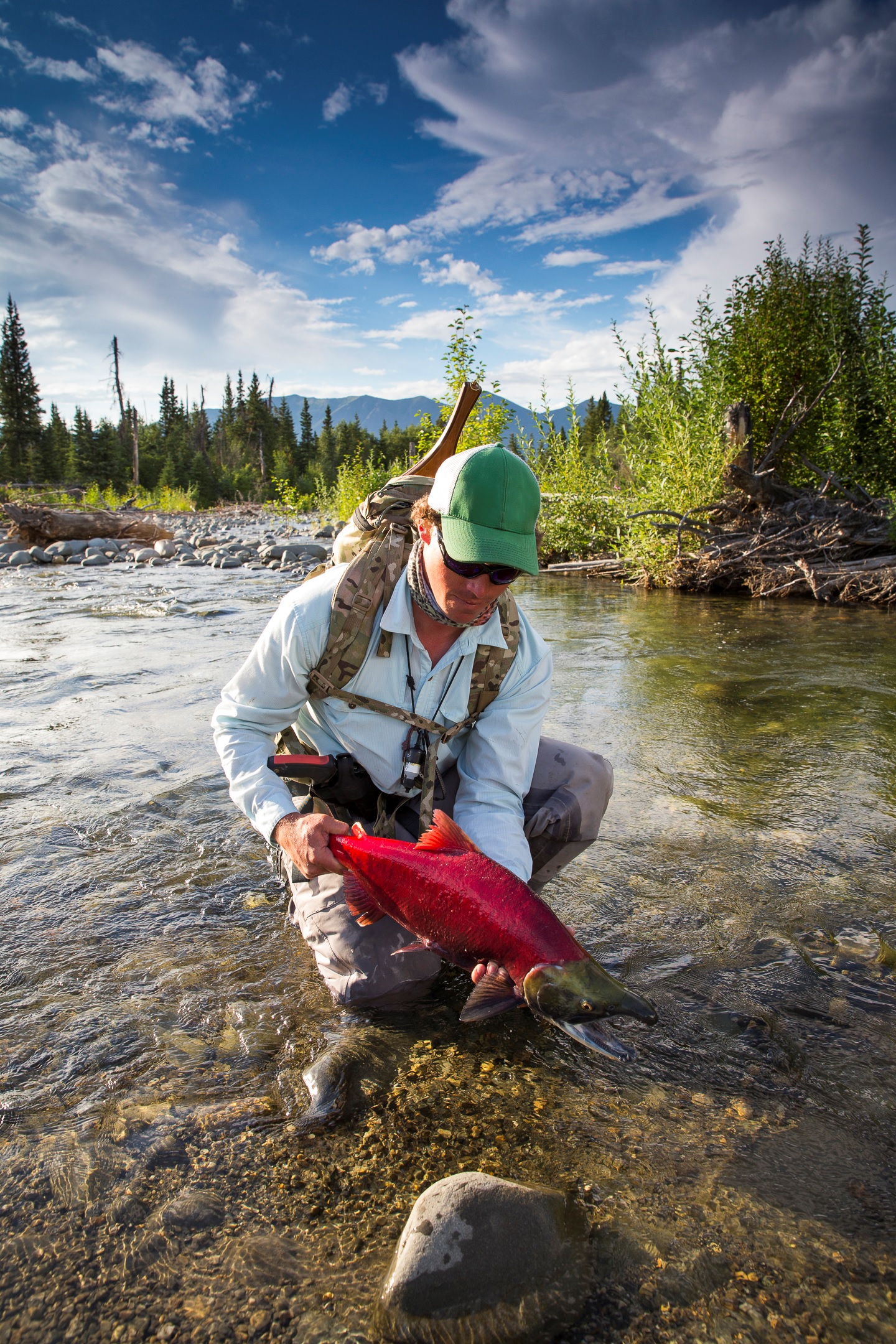 A guest at Natural Retreats Tsaina Lodge hauls in an impressive Sockeye Salmon.