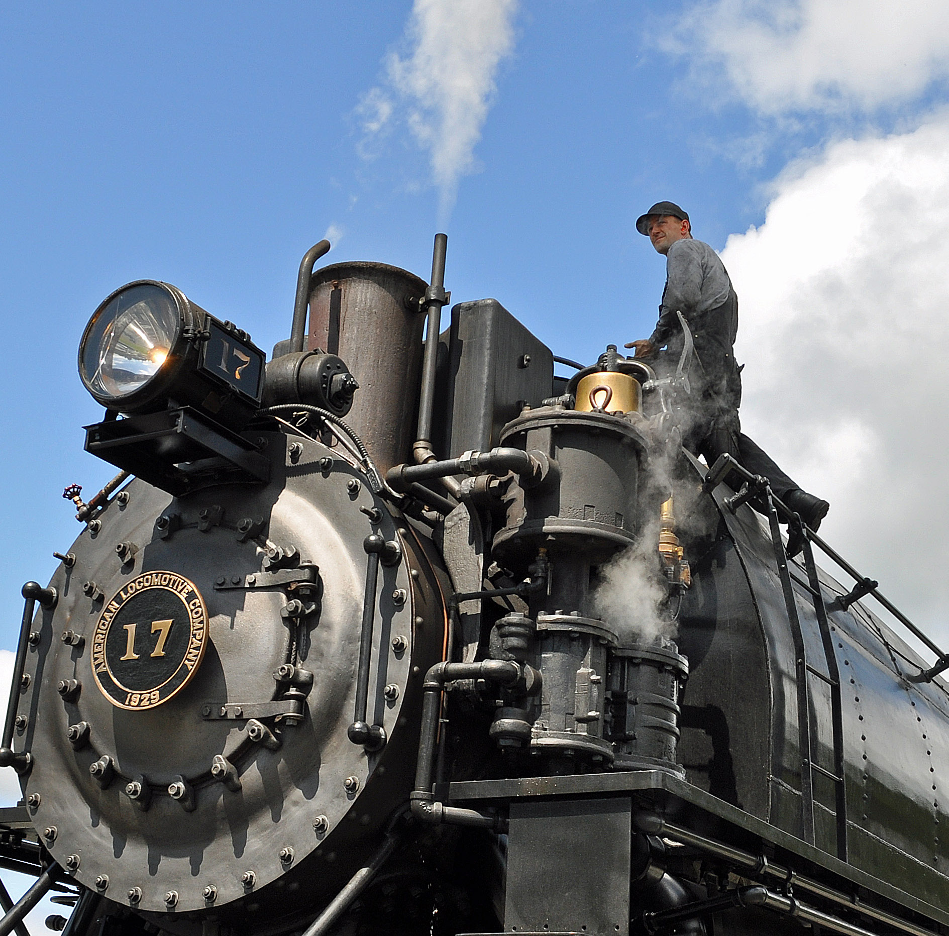 Volunteer Engineer at Mt. Rainier Scenic Railroad & Museum Checks on a Steam Engine Photo Courtesy Anthony Koopman