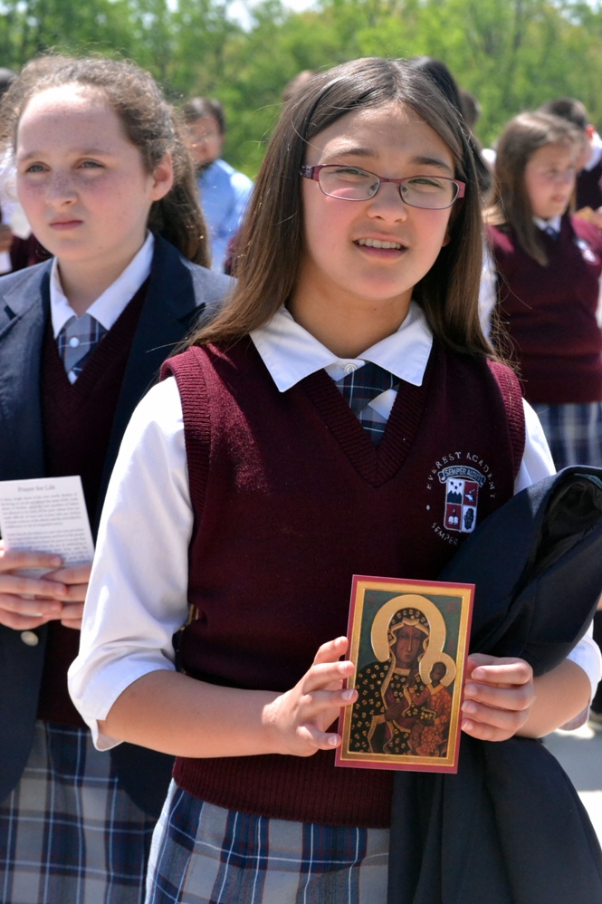 Cassandra displays the Prayer for Life card in commemoration of the visit of Our Lady of Czestochowa to North America