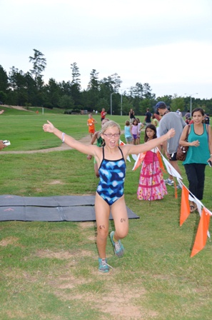 A child experiences a triumphant moment during the Morrison Family YMCA’s Kids Tri Ballantyne.