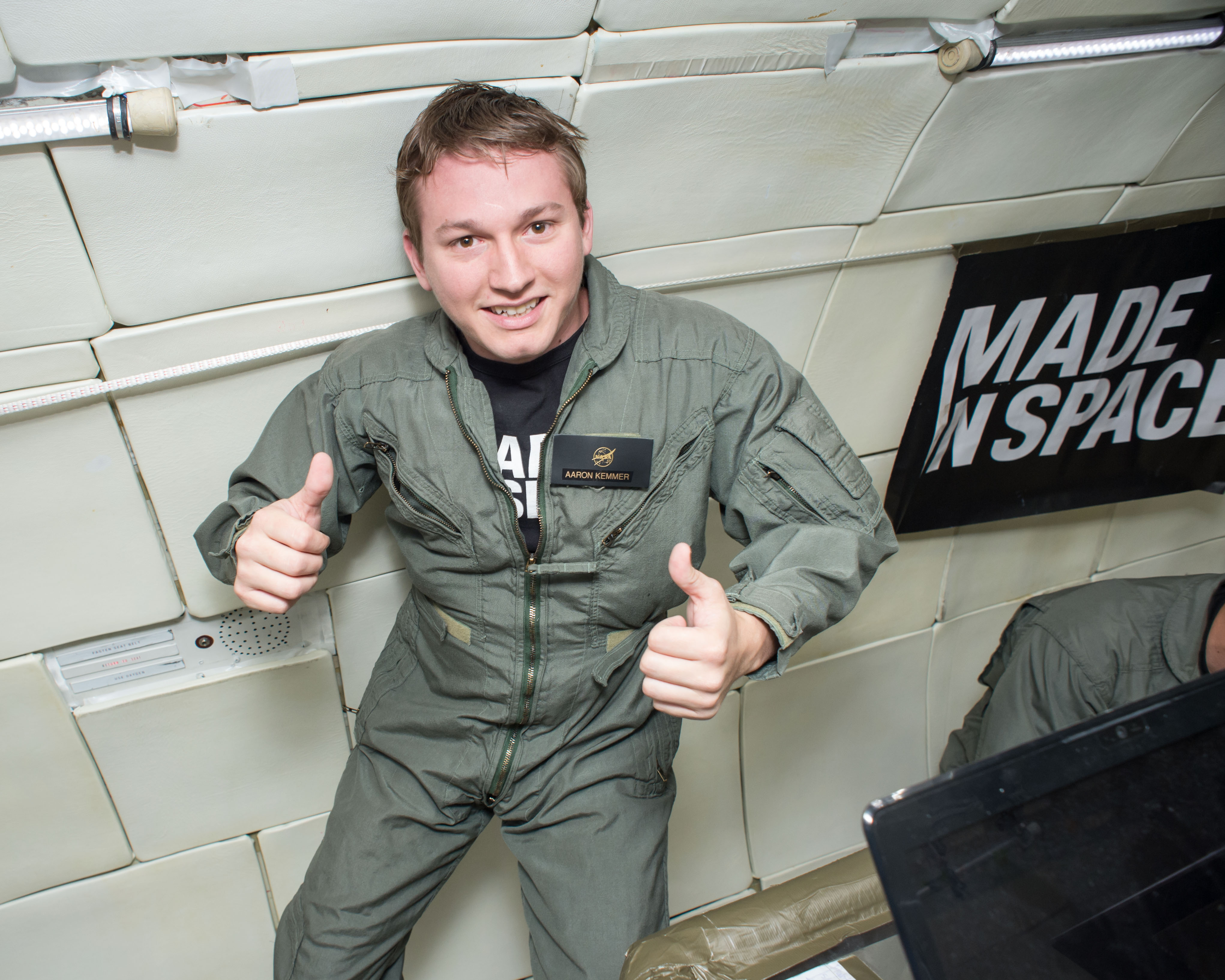 Made In Space CEO Aaron Kemmer during 2013 microgravity tests of the space-bound printer aboard Zero-G Corporation’s modified Boeing 727.