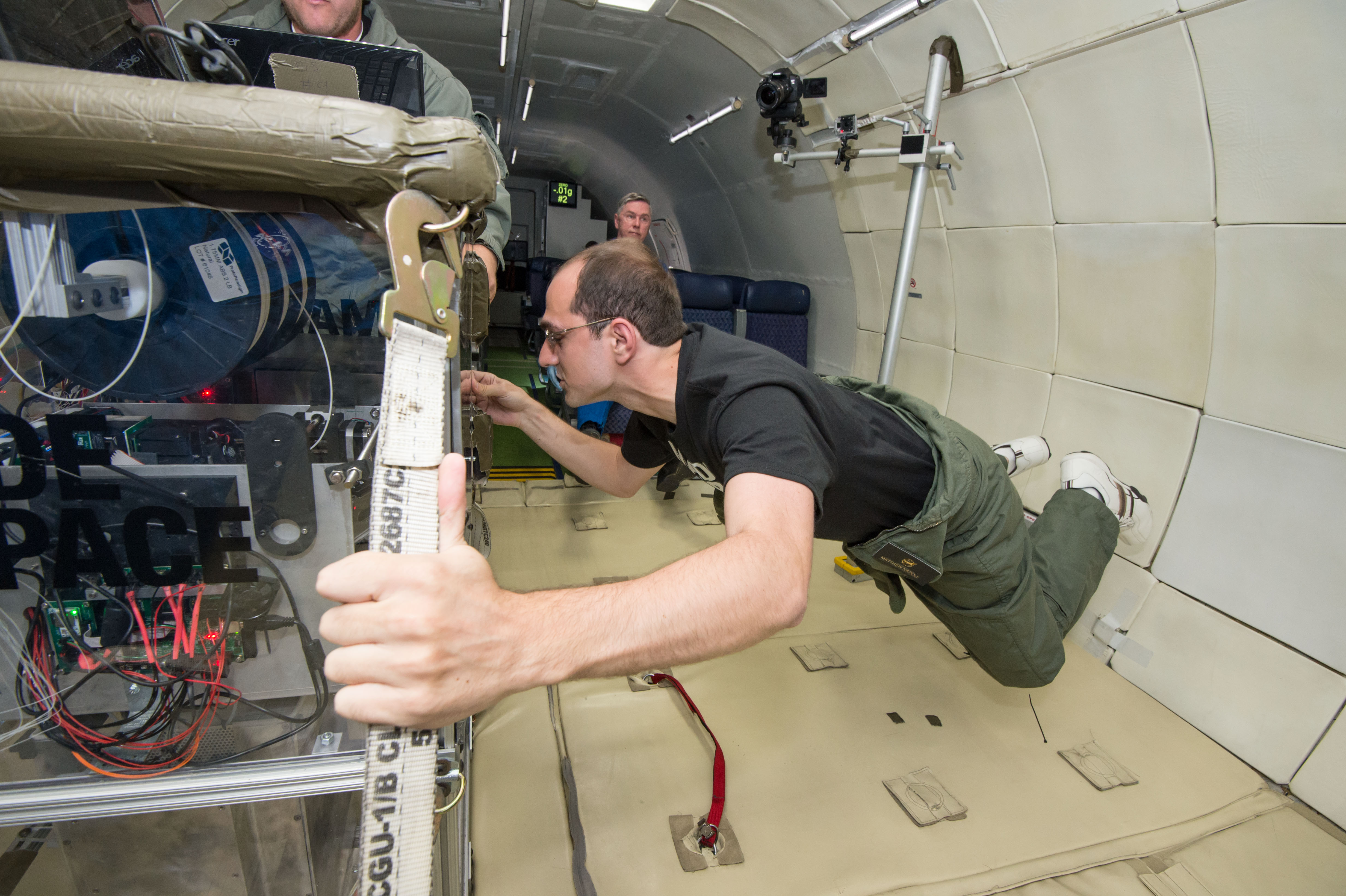 Made In Space Lead Deputy Program Manager Matthew Napoli tests the space-bound printer during a 2013 microgravity flight aboard Zero-G Corporation’s modified Boeing 727.