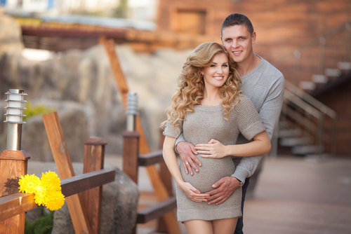 Joining mother for an expecting baby portrait