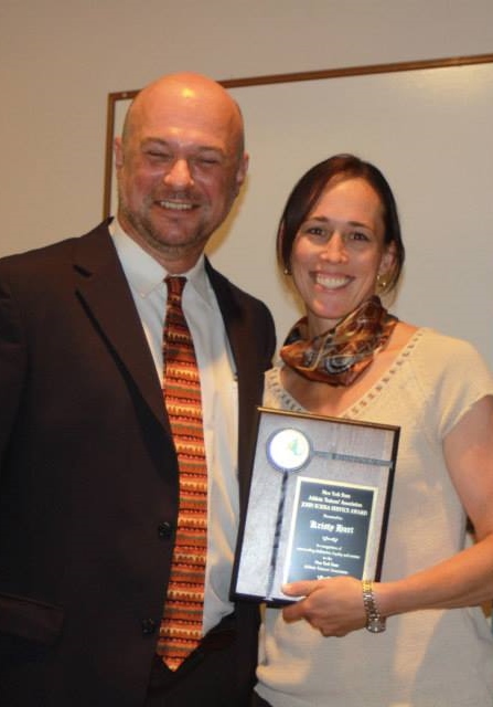 2014 Sciera Service Award recipient, Kristy Hart (right), recognized by NYSATA Awards Chair, Andy Smith.