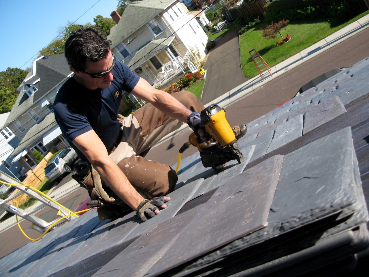 Contractor Mark Clement installs DaVinci Roofscapes polymer slate roofing tiles.