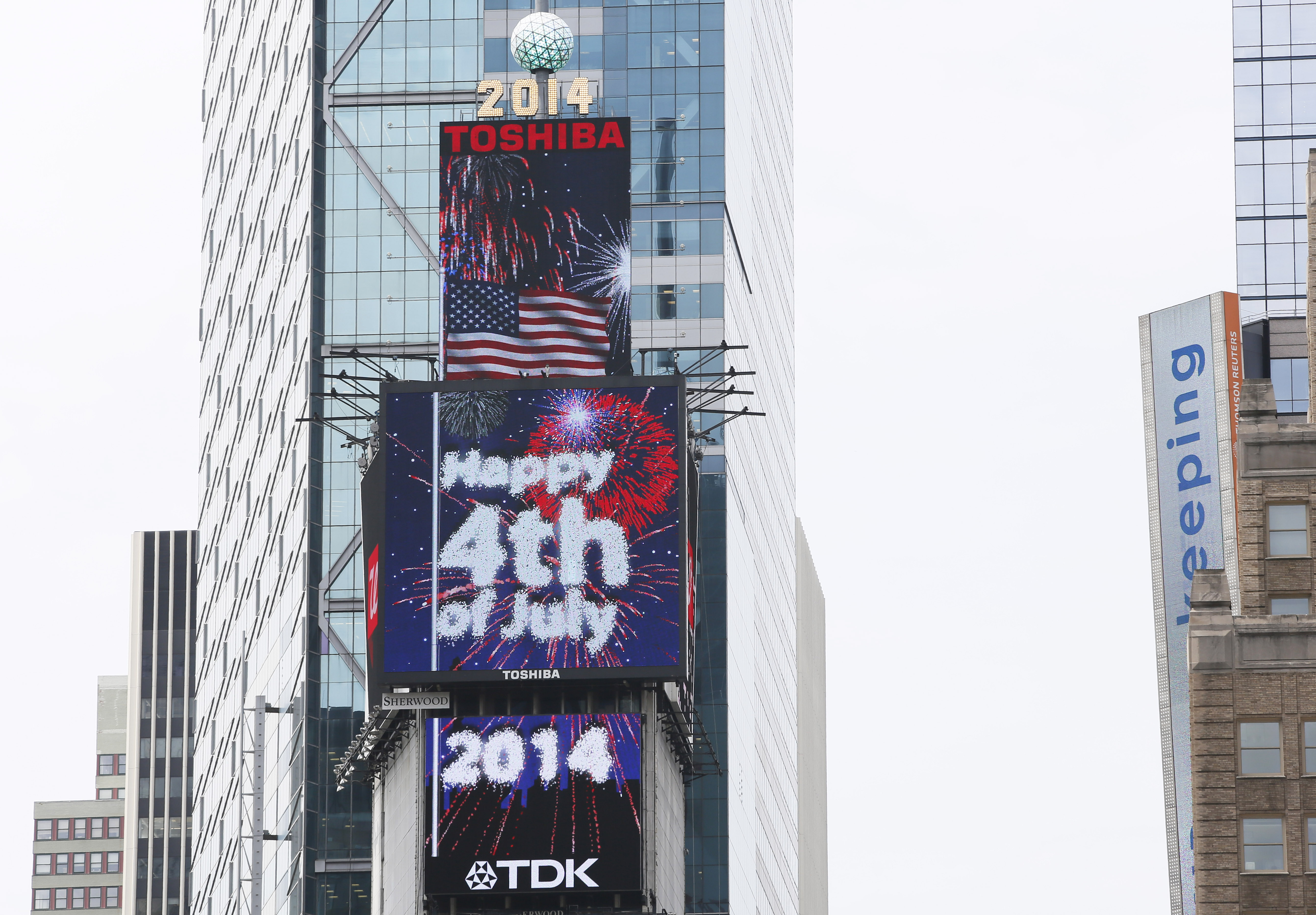 A patriotic tribute to the 4th of July lights up New York's Times Square, as a giant digitally-animated fireworks spectacular is featured on the Toshiba Vision and TDK Screens atop One Times Square, t