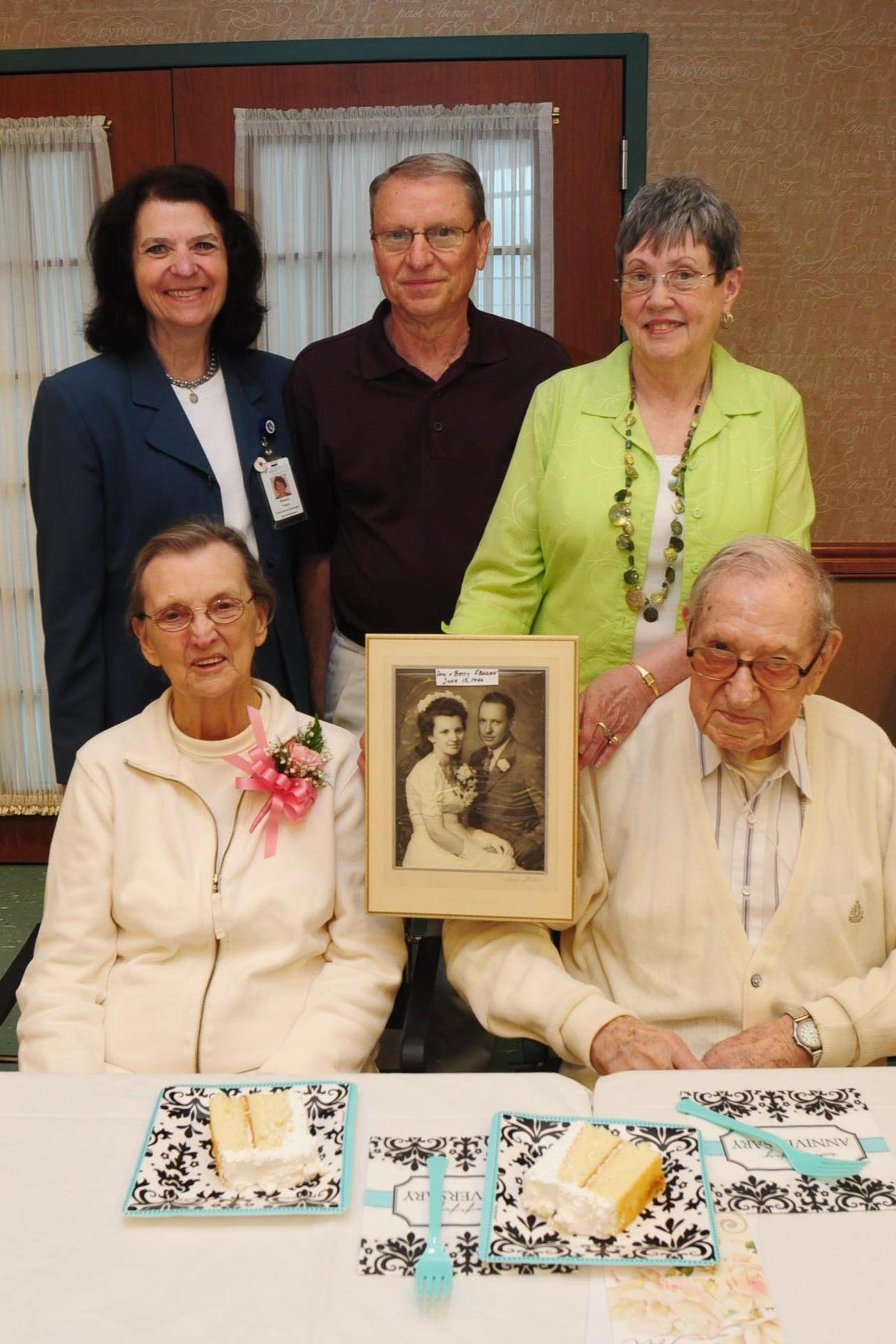 Betty and Don Ebaugh celebrate their 68th anniversary with their daughter, and son-in-law, Pat (holding photo) and Rich Kowal of Austintown, and Robin Hages, Humility House executive director.