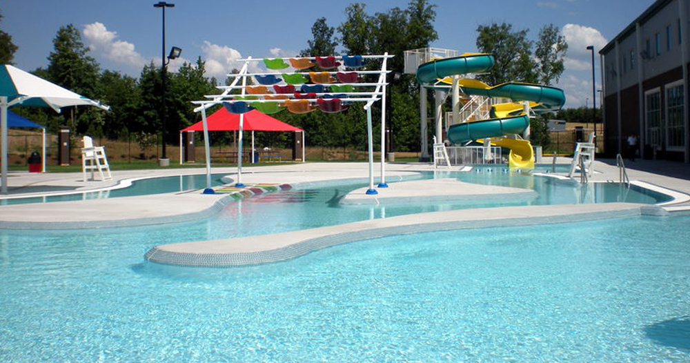Perfect staycation: The outdoor leisure pool features a slide, lazy river, and play structures for children.