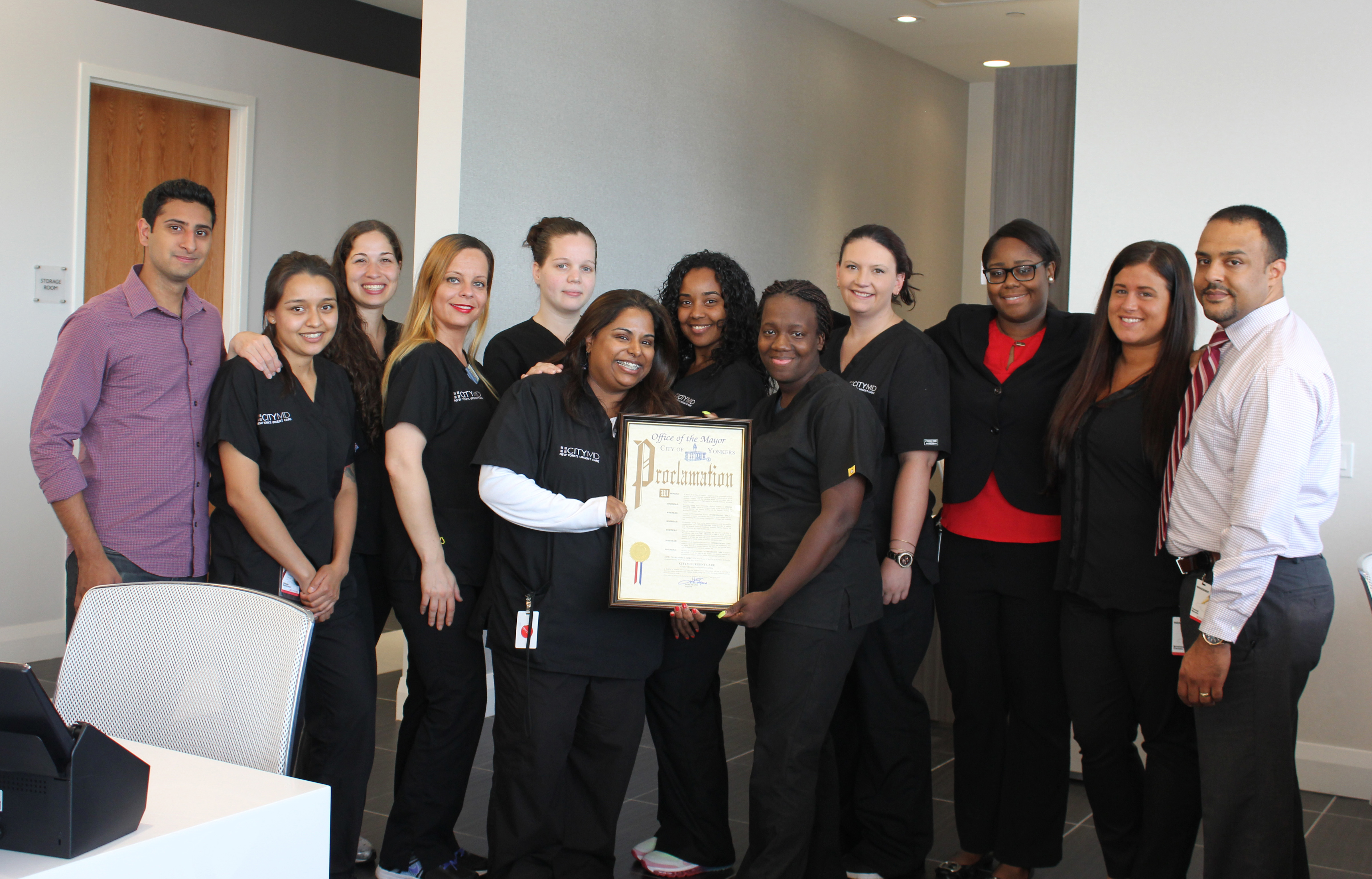 Photo Caption 2: CityMD staff displays the City of Yonkers Proclamation.